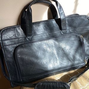 Leather briefcase holds laptop